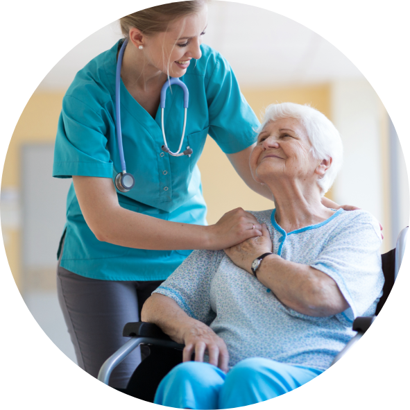Healthcare professional and elderly woman in a wheelchair sharing a warm interaction.