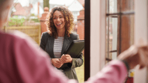 patient greeting social worker at the door