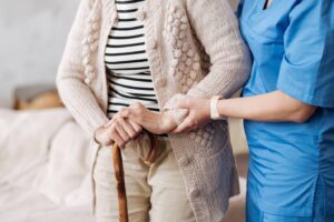 nurse helping patient walk