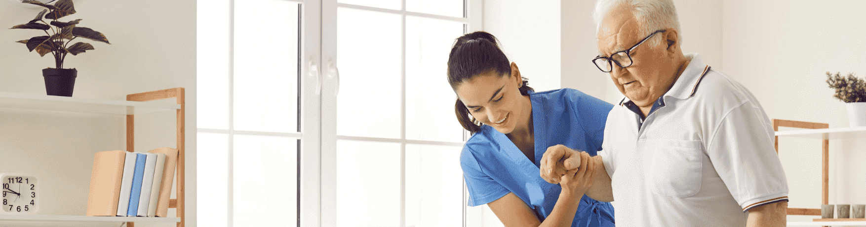nurse helping a patient walk in the comfort of home