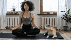 woman meditating with dog